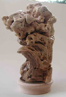 Crouching female, fleeing the Divine, one side of three-sided wood sculpture